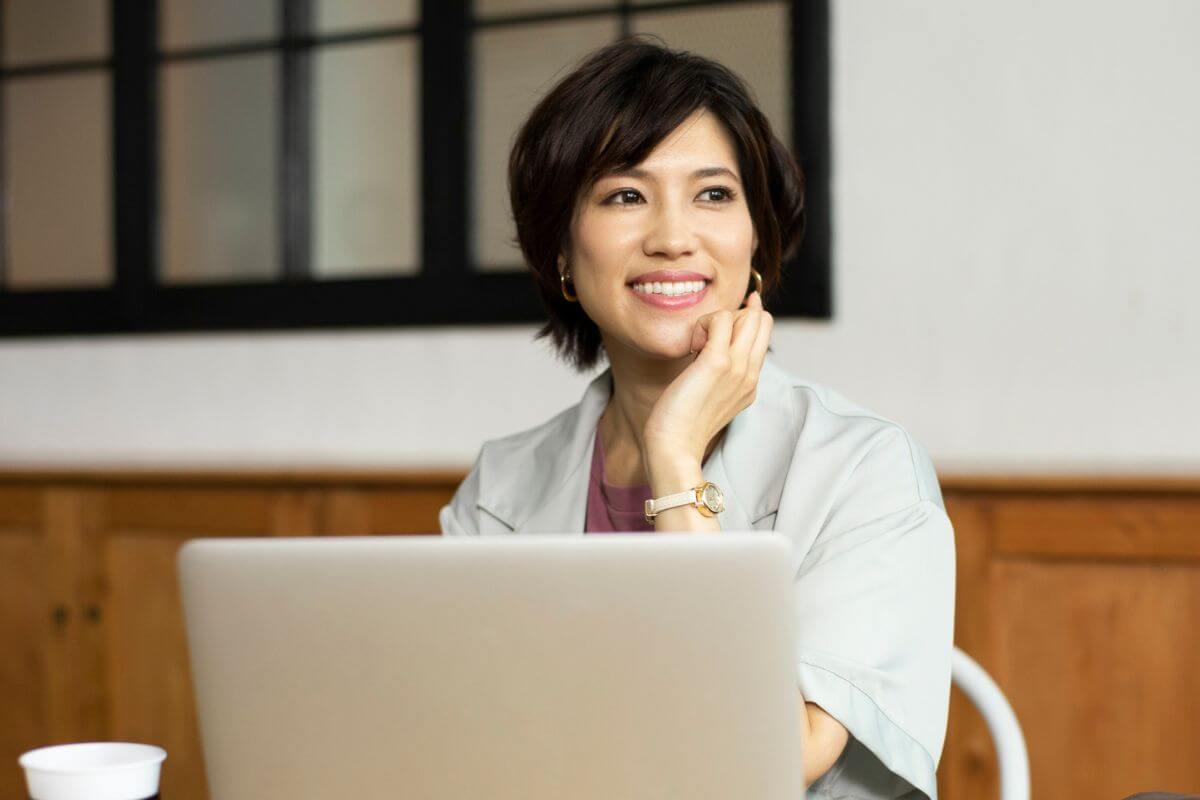A picture of someone thinking while smiling.