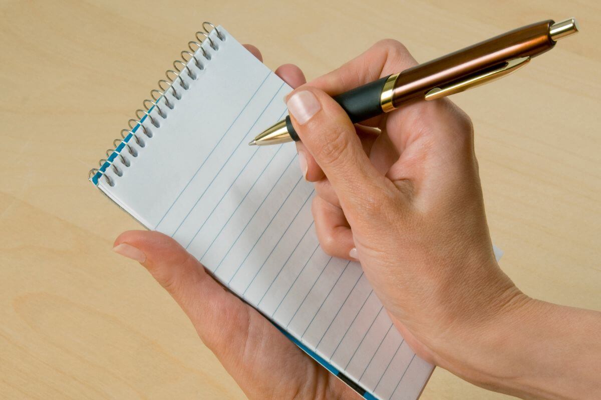 A picture of someone taking notes.