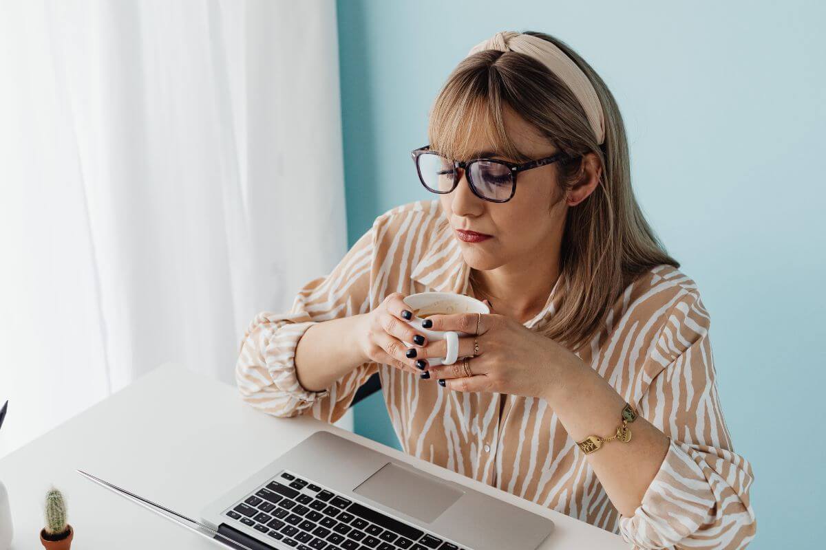 A picture of a woman drinking coffee.