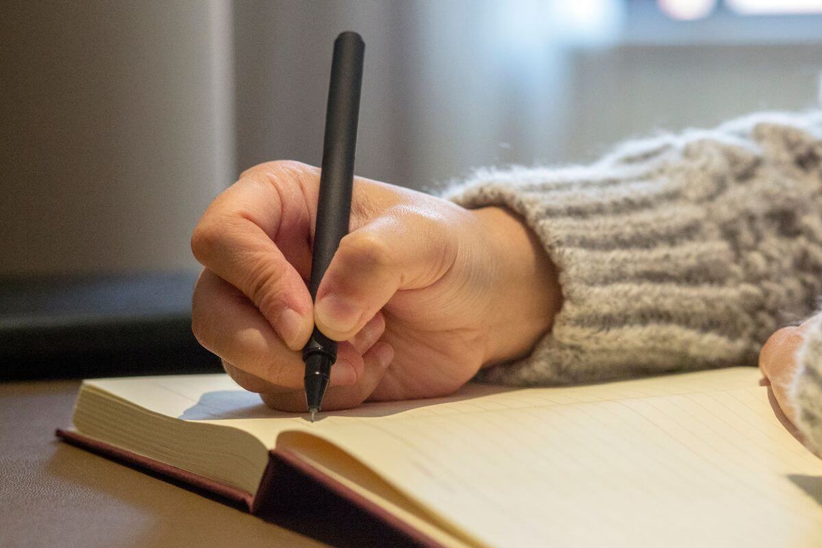 A picture of someone writing something.