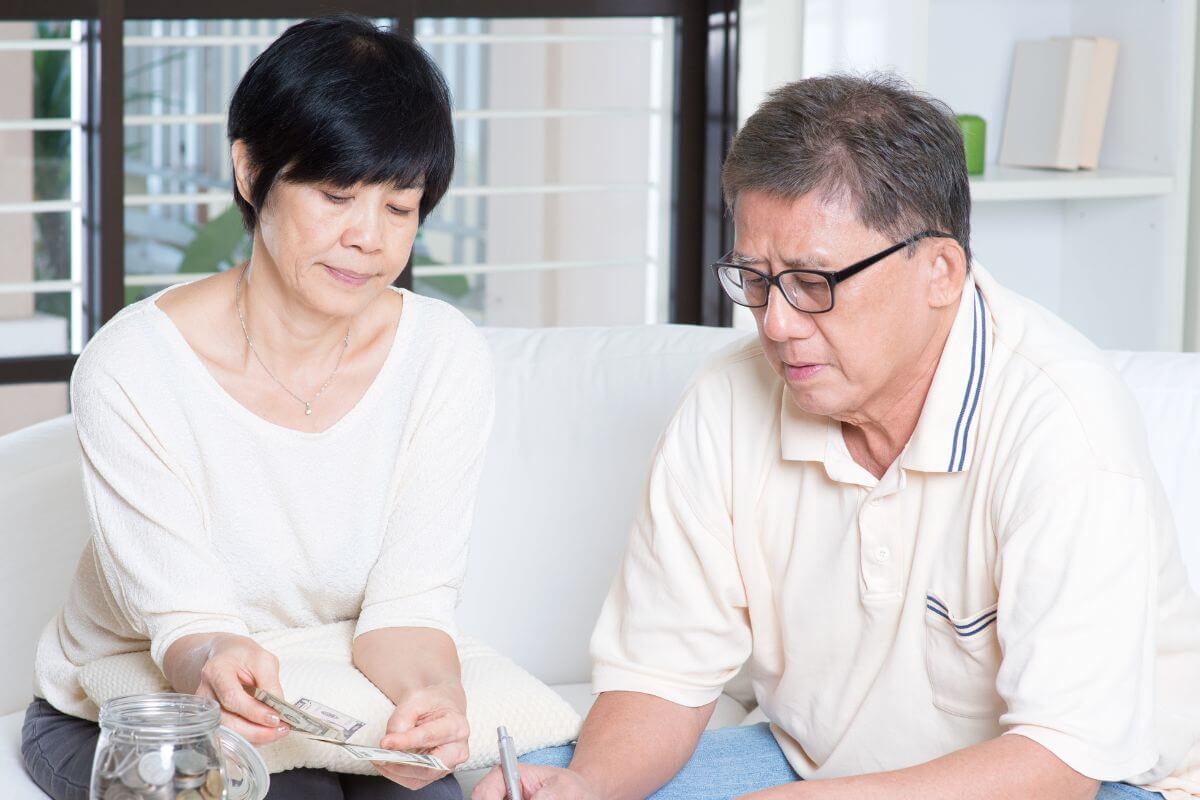 A picture of retirees counting money.