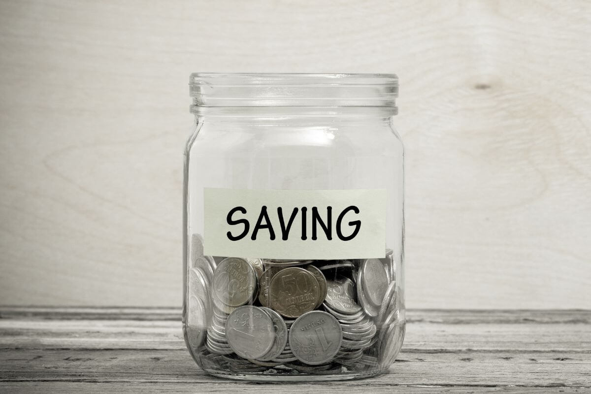 A picture of a jar of savings.