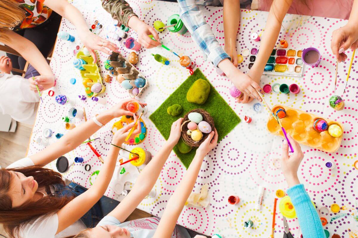 An image shows a family doing a creative activity.