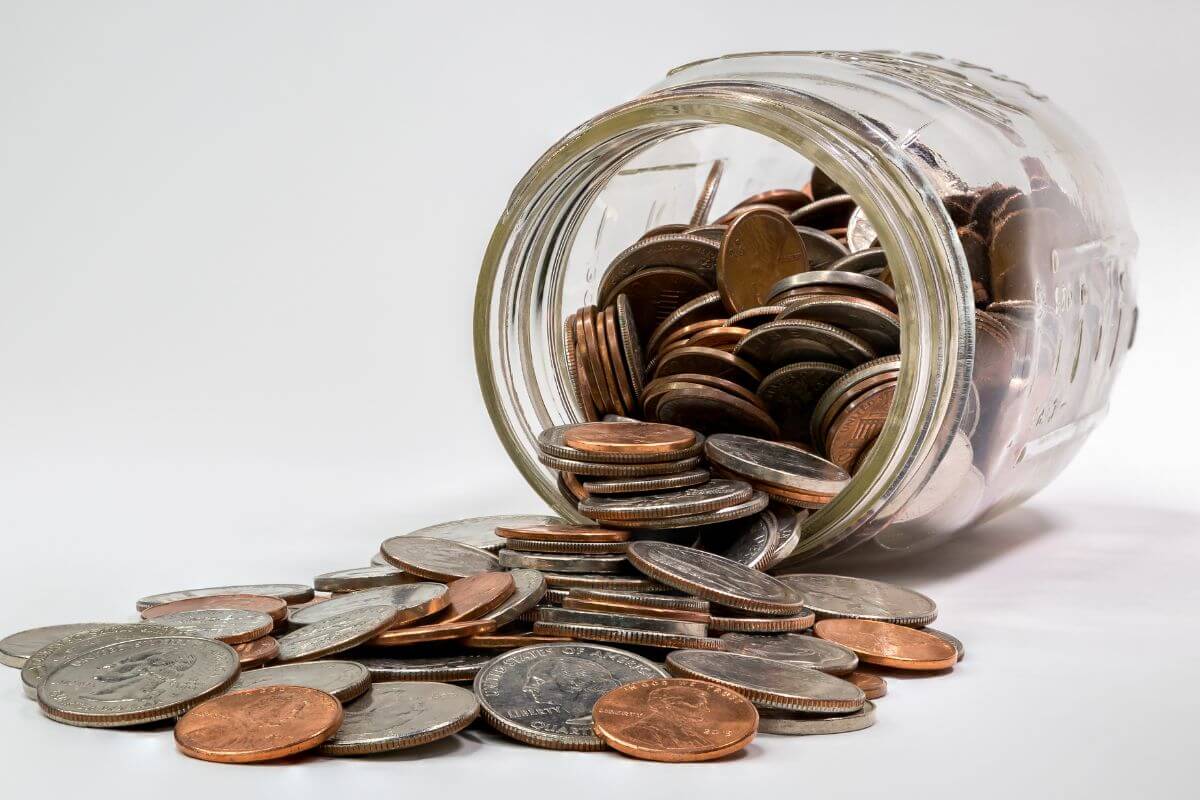 An image shows a jar with coins.