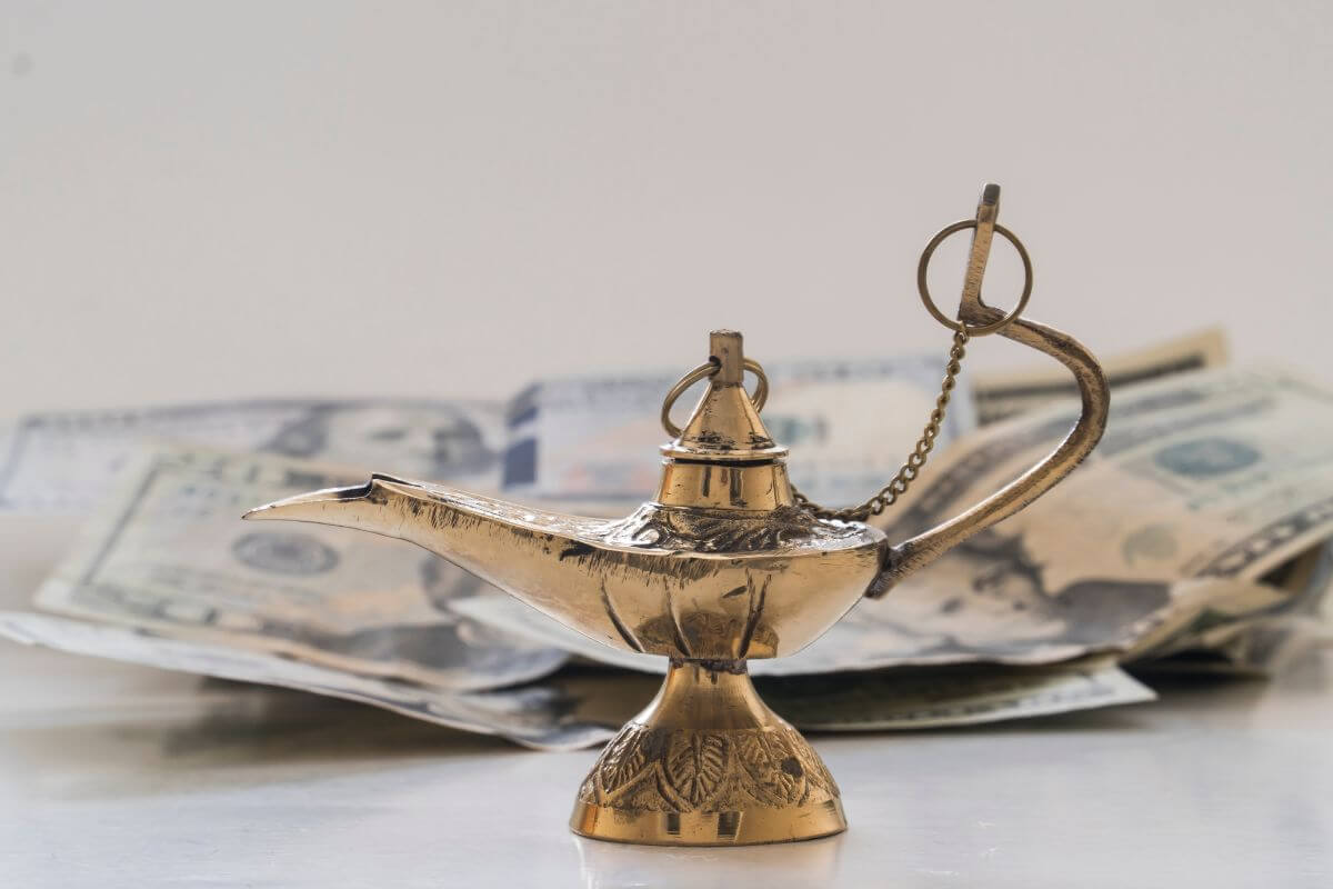 A picture of a kettle and money.