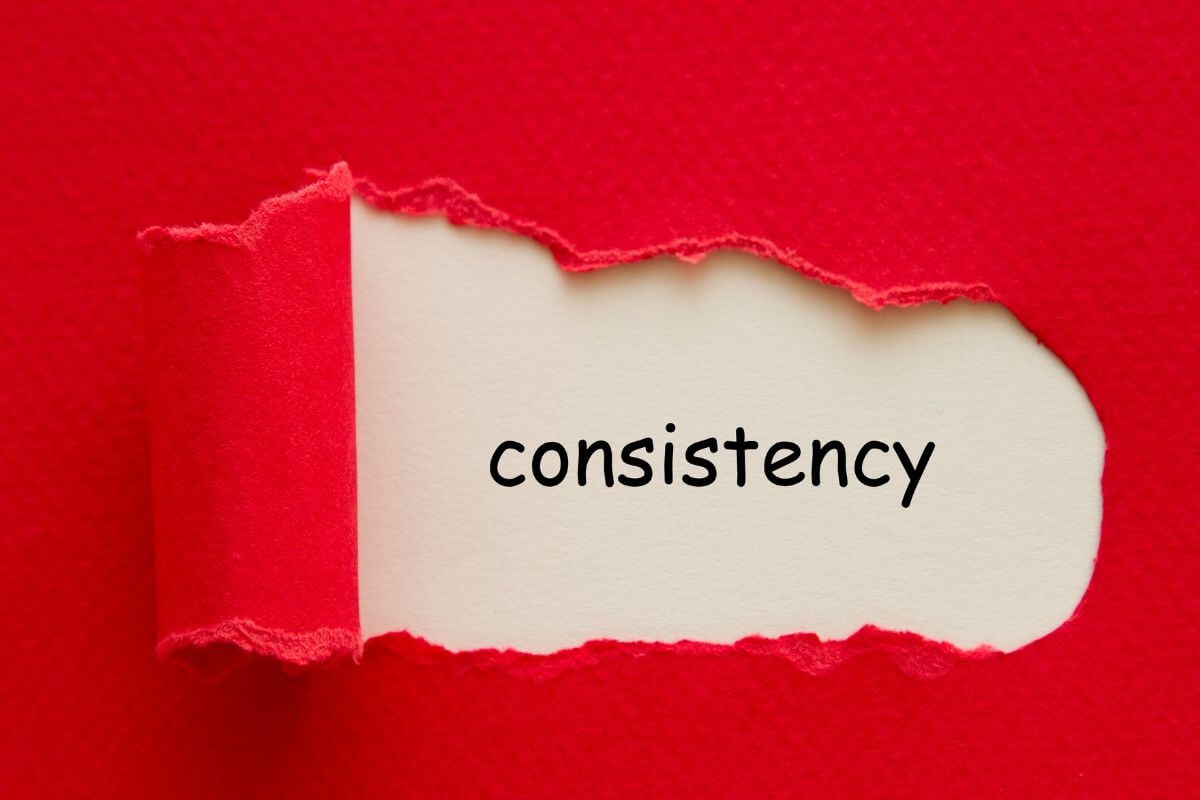 A picture shows consistency wording in torn paper.