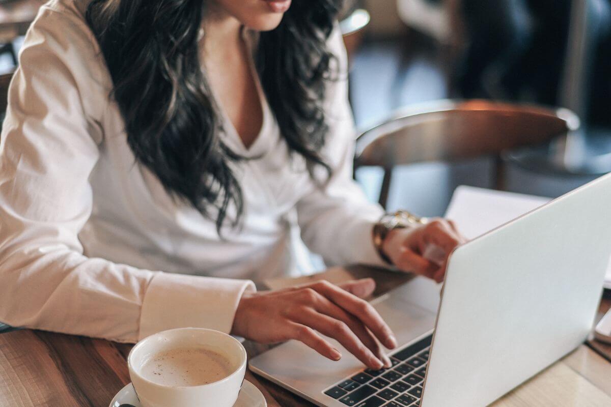 A picture shows a woman using a laptop.