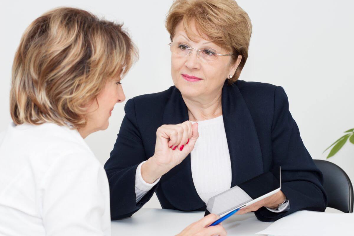 A picture of a financial advisor and her client.