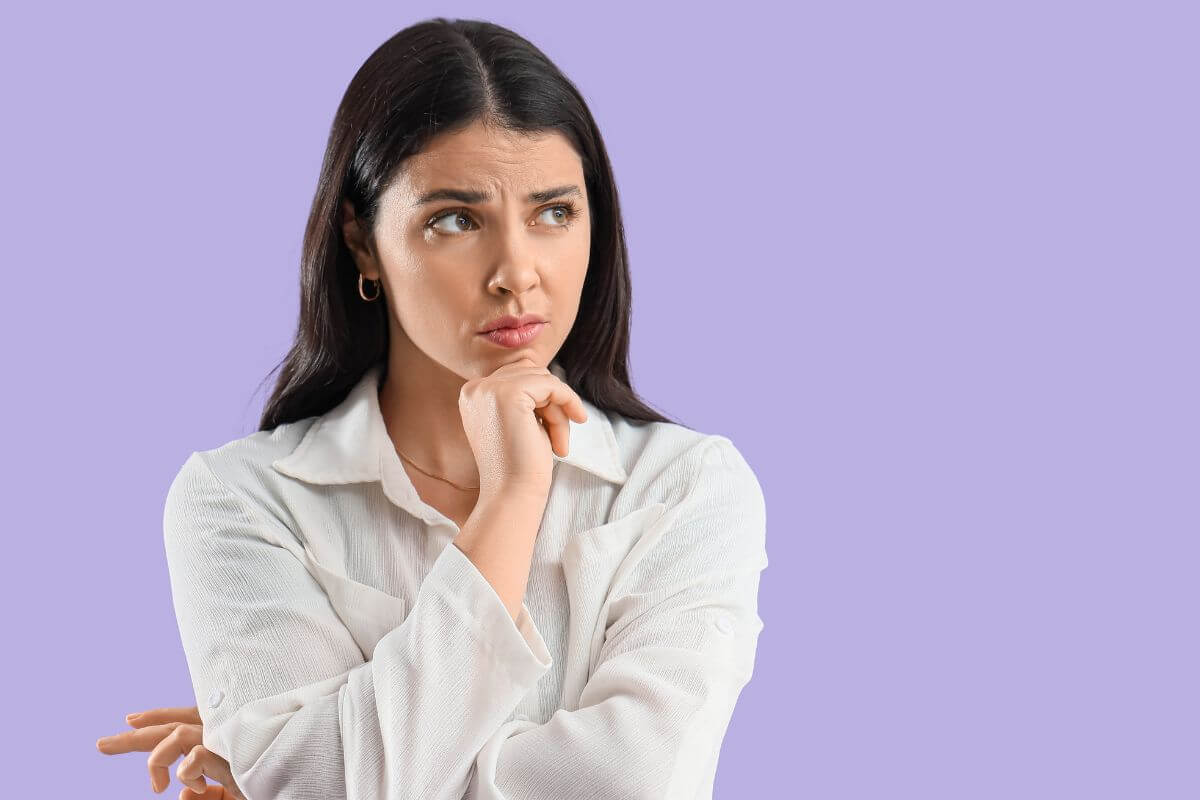 An image shows a woman deciding.