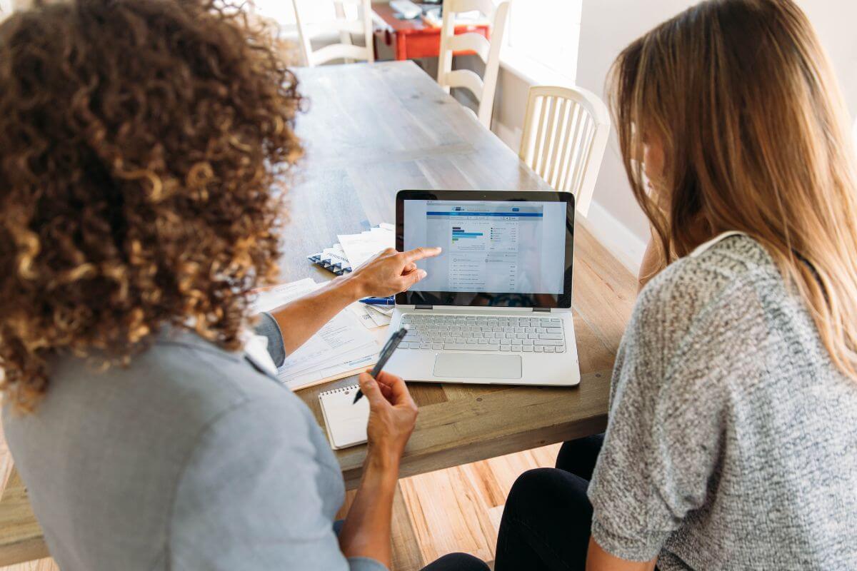A picture of a financial advisor guiding her client.