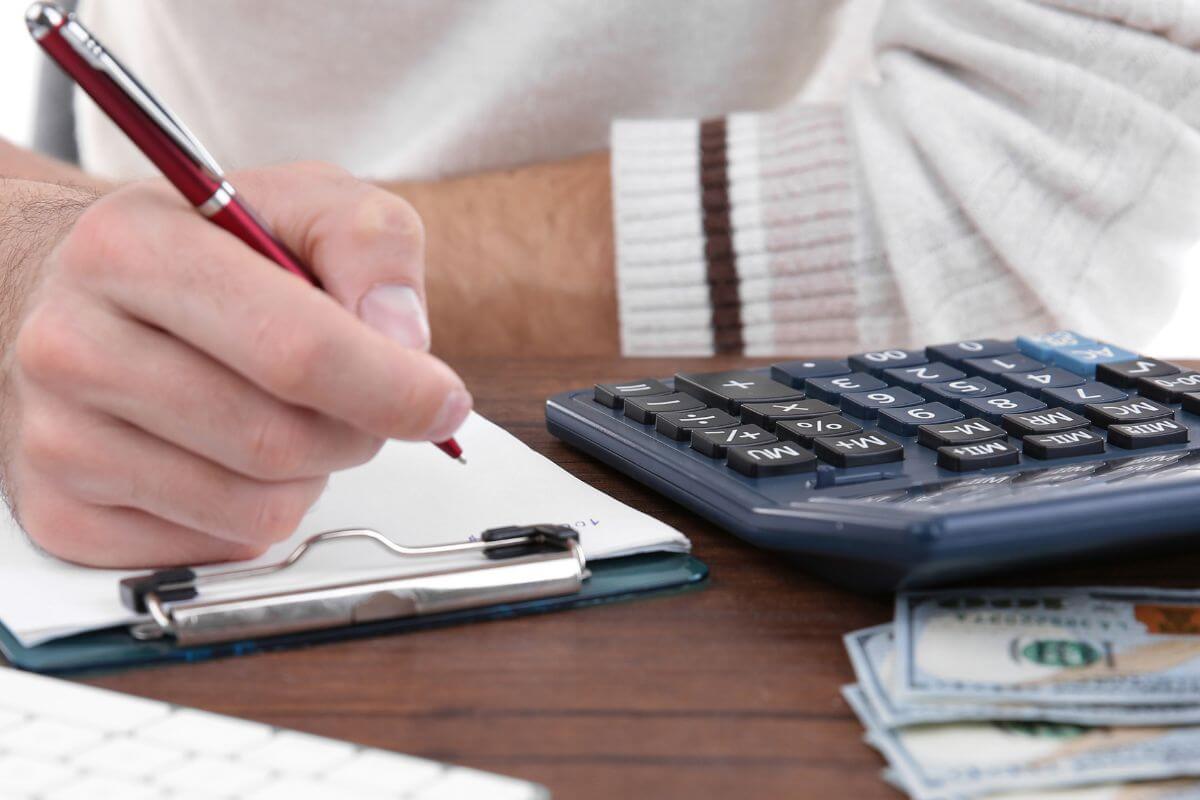 An image of a man reviewing his budget.