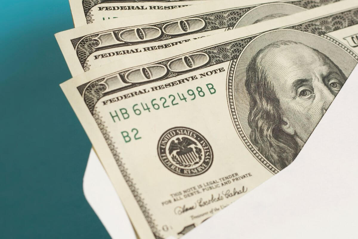 A picture of an envelope with money.