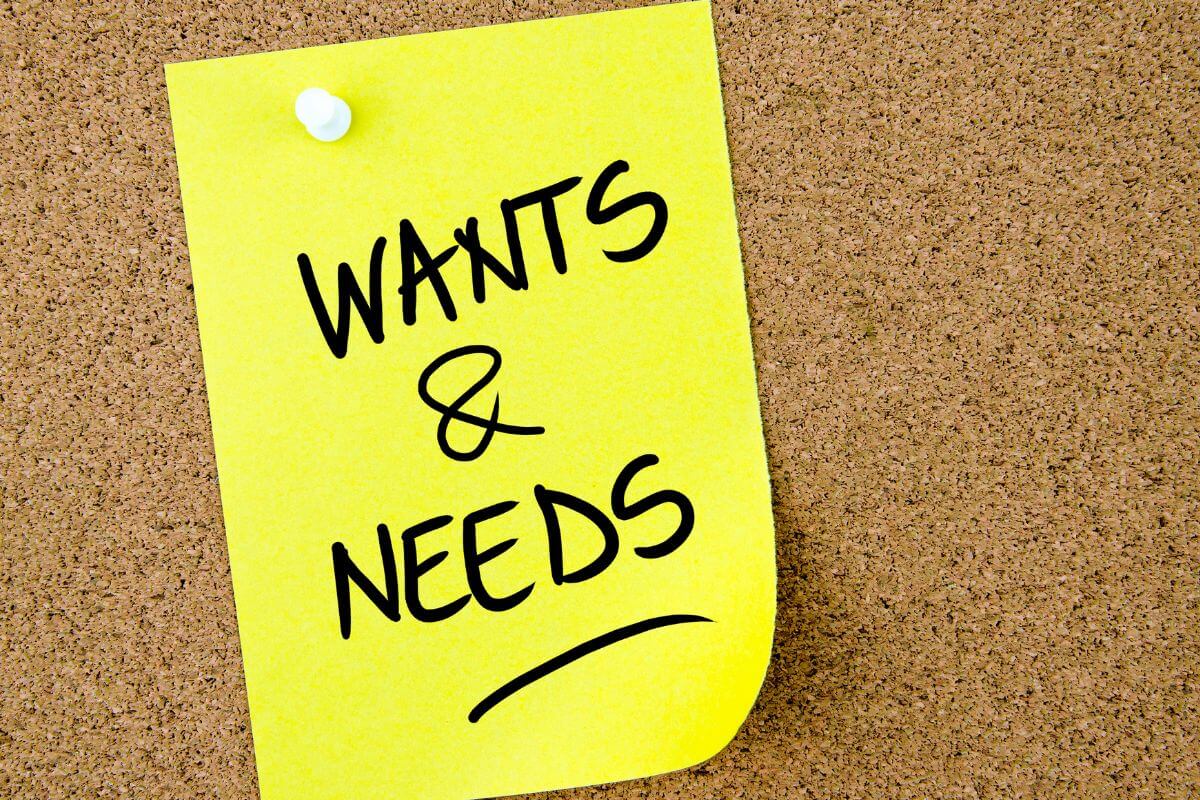 A picture of a paper with wants and needs wording.