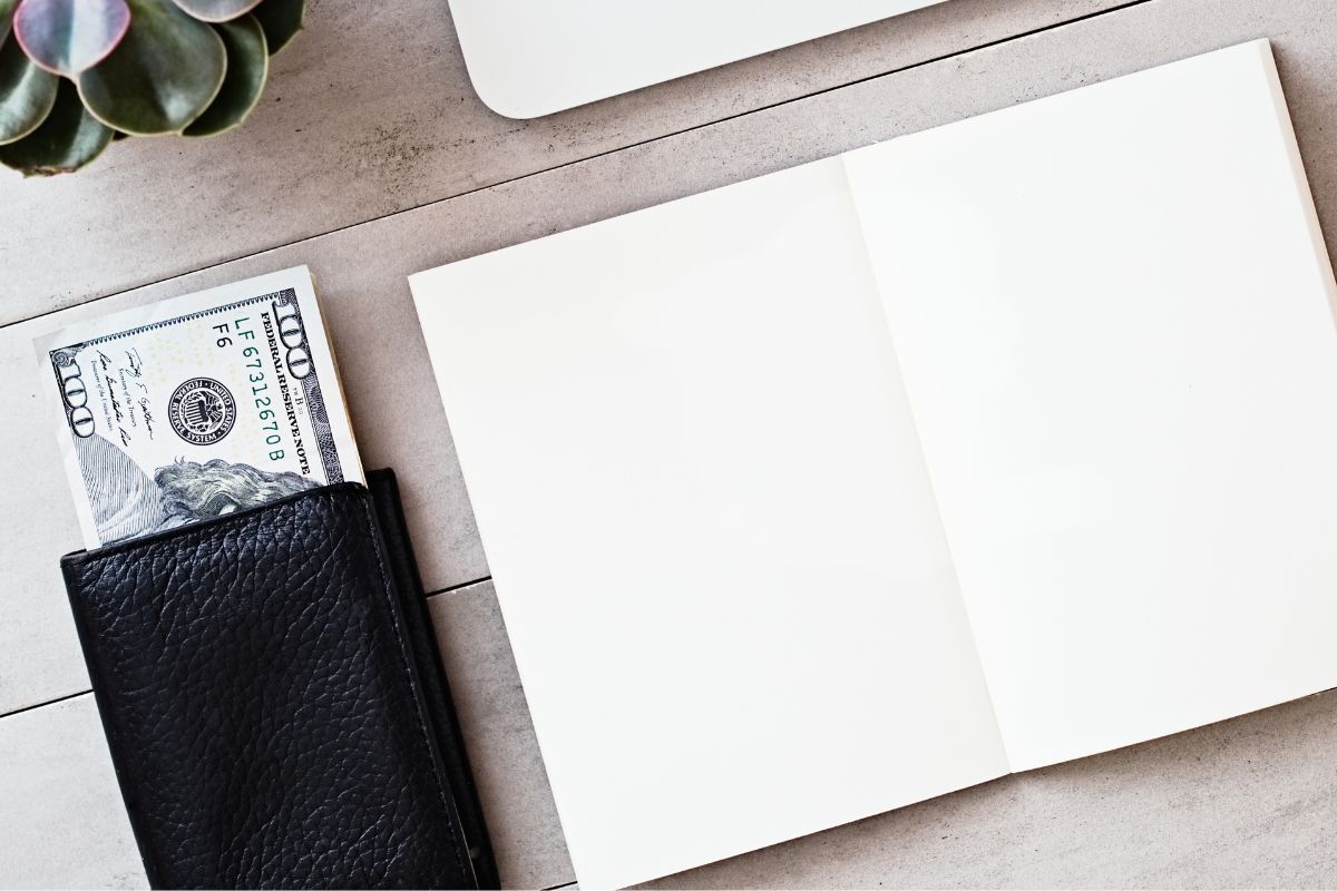 A picture of a notebook and money.