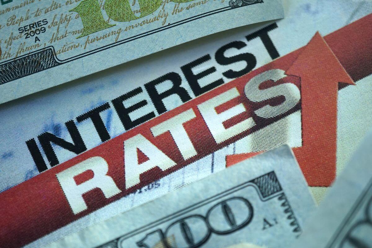 A picture of money and interest rates wording.
