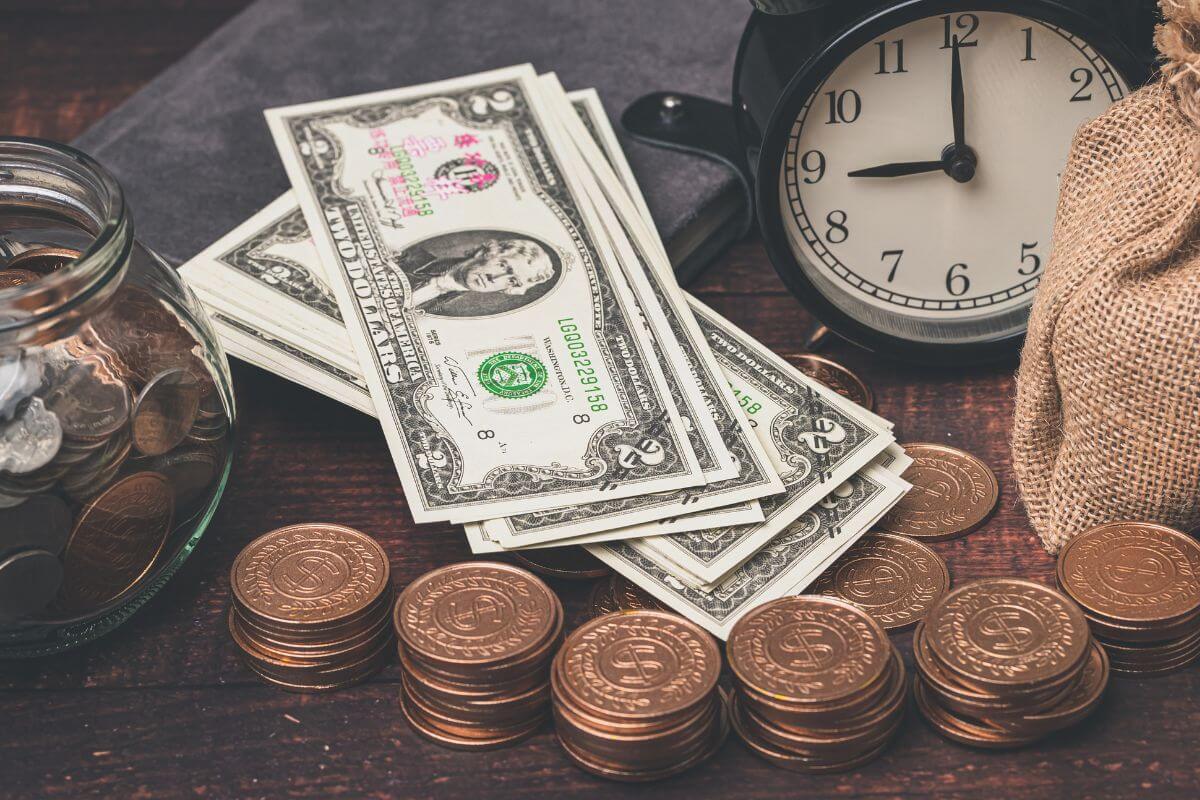 An image shows money and a clock.