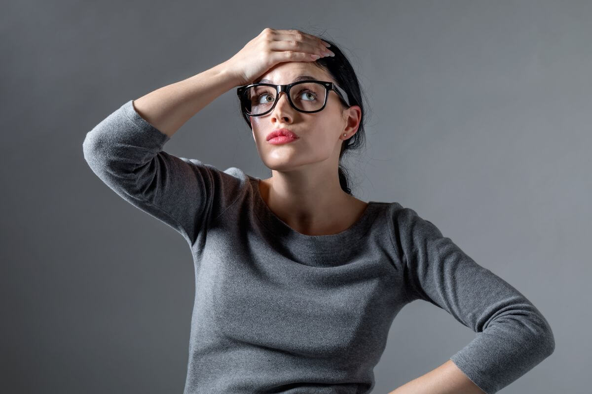 An image shows a frustrated woman.