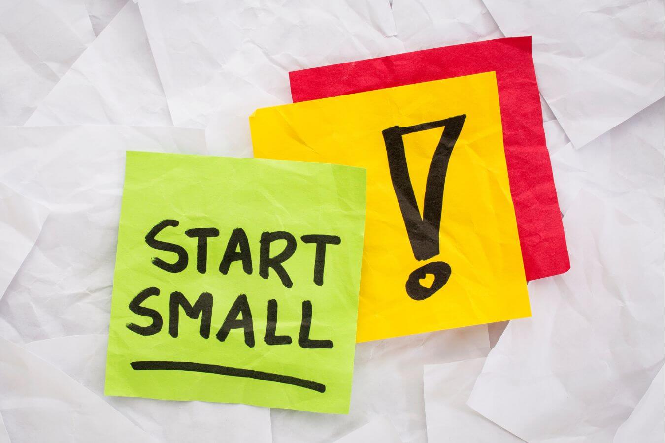 An image shows a paper with Start Small written on it.
