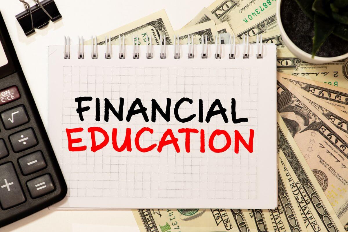A picture of a notebook with financial education wording.