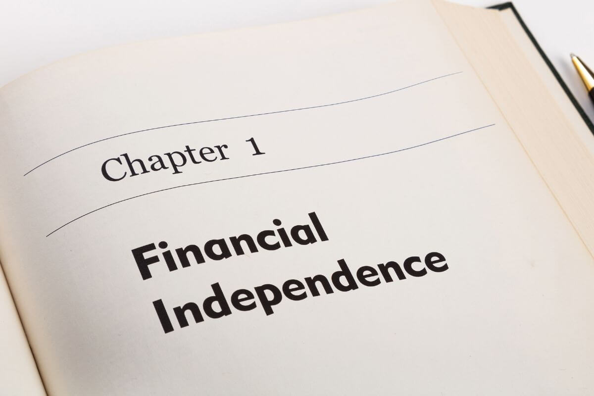 An image shows a paper with financial independence wording.