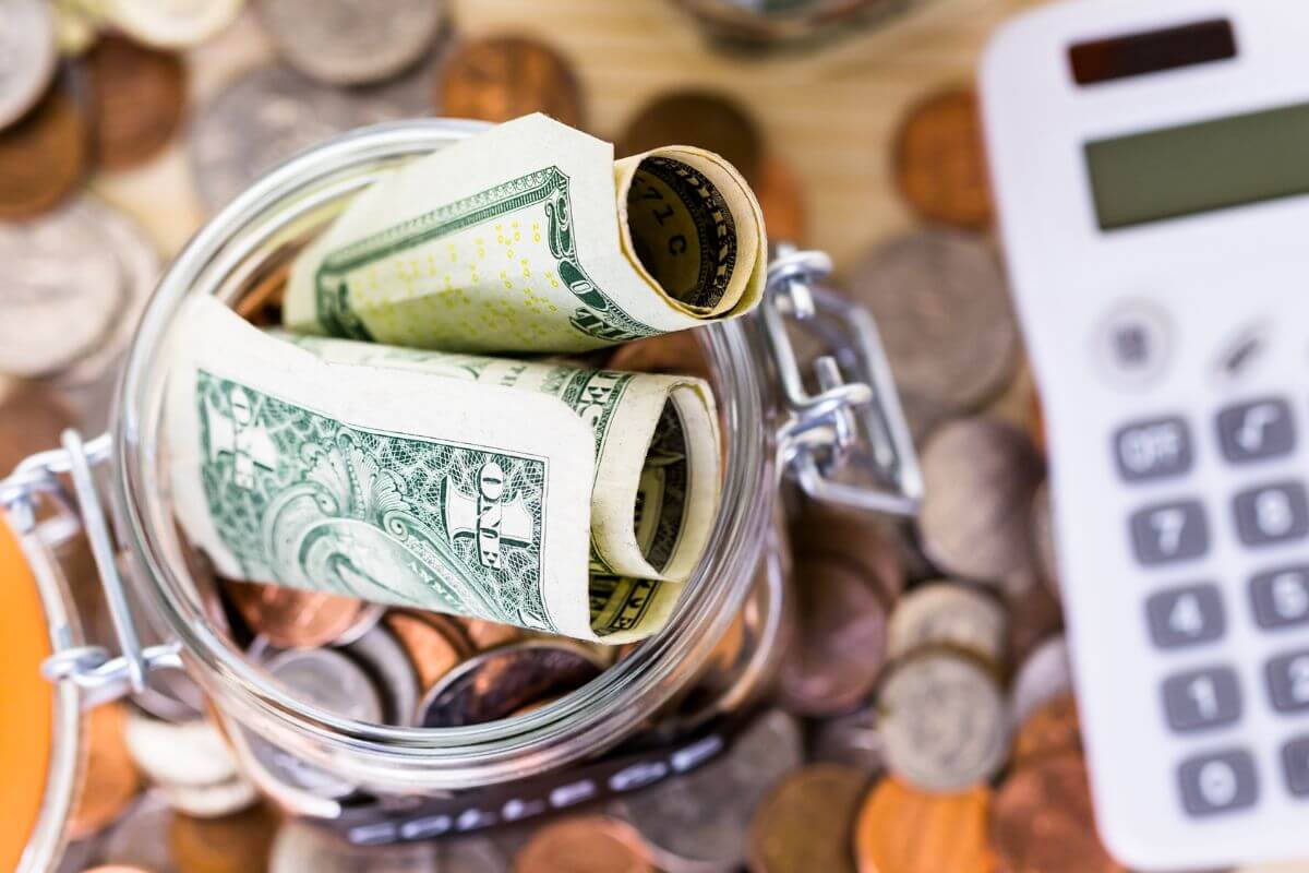 A picture of a jar with money.