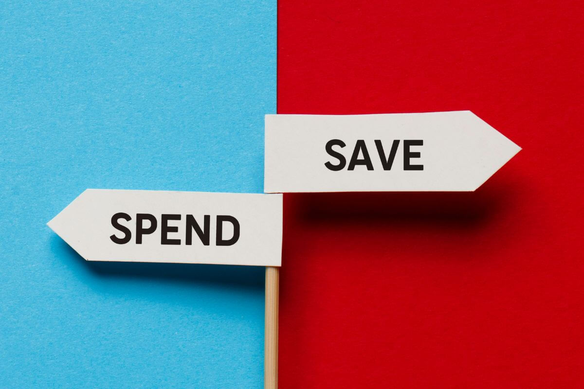 An image shows flags with save and spend wording.