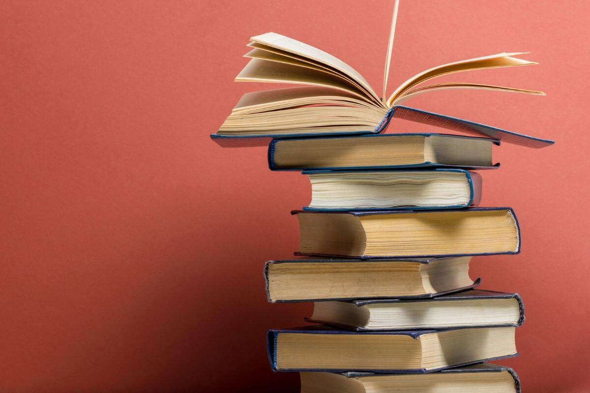 A picture shows a pile of books.