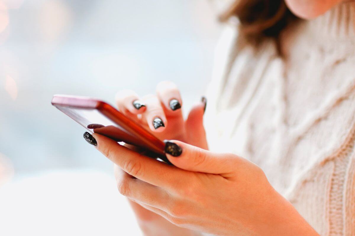 An image of a woman using a phone.