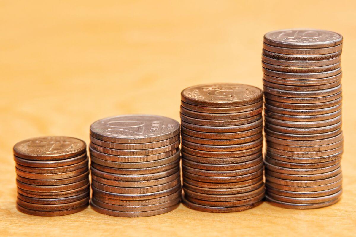 An image shows stacks of coins.