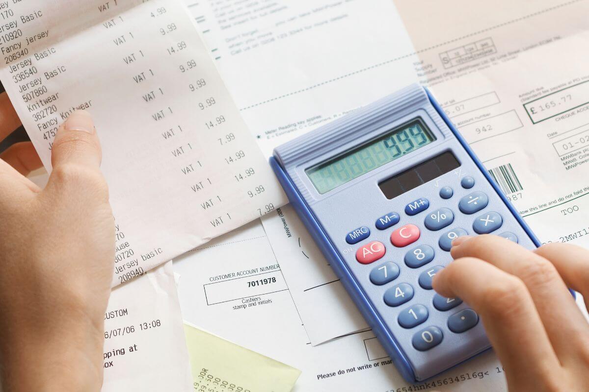 A picture shows a woman calculating something.