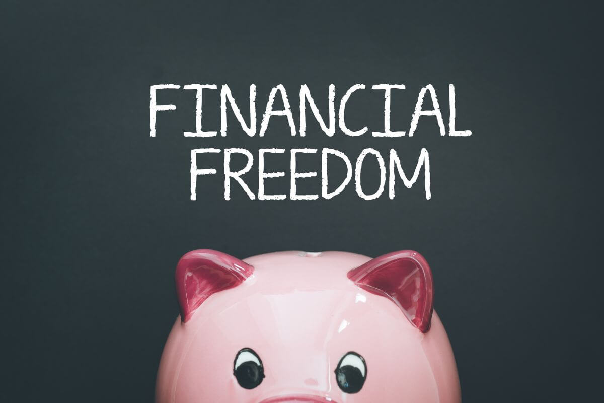 A picture shows a piggy bank and financial freedom wording.