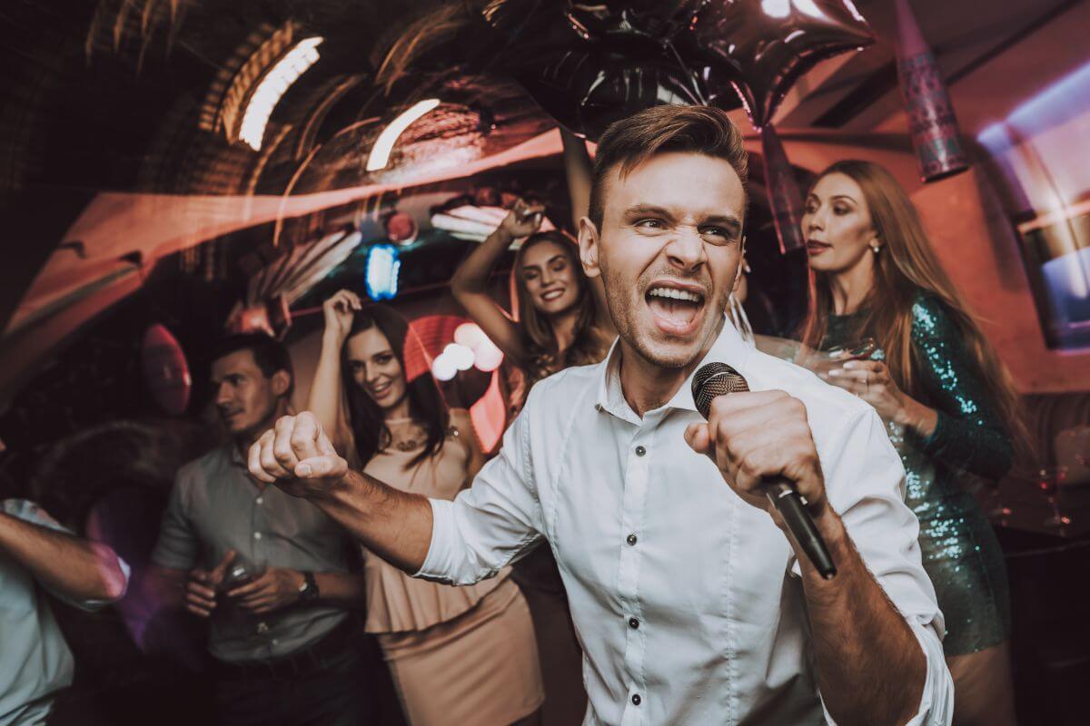 A picture shows a group of friends enjoying karaoke.