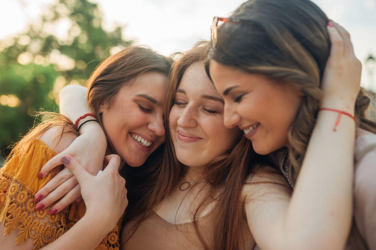 A picture shows women hugging each other.