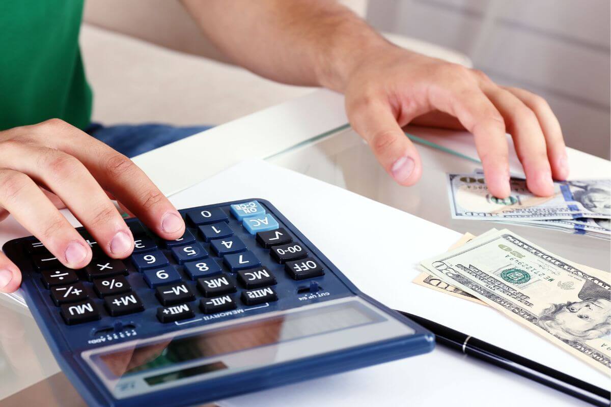 An image of a man budgeting money.