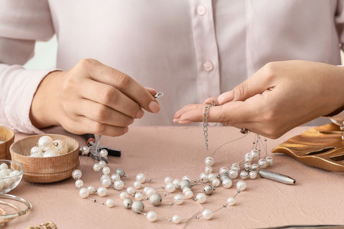 A picture shows a woman making jewelry.