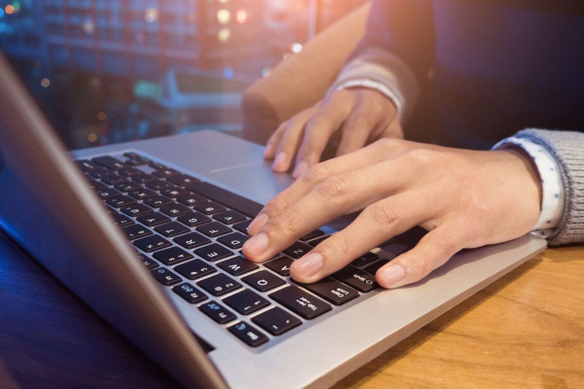 A picture shows a man using a laptop.
