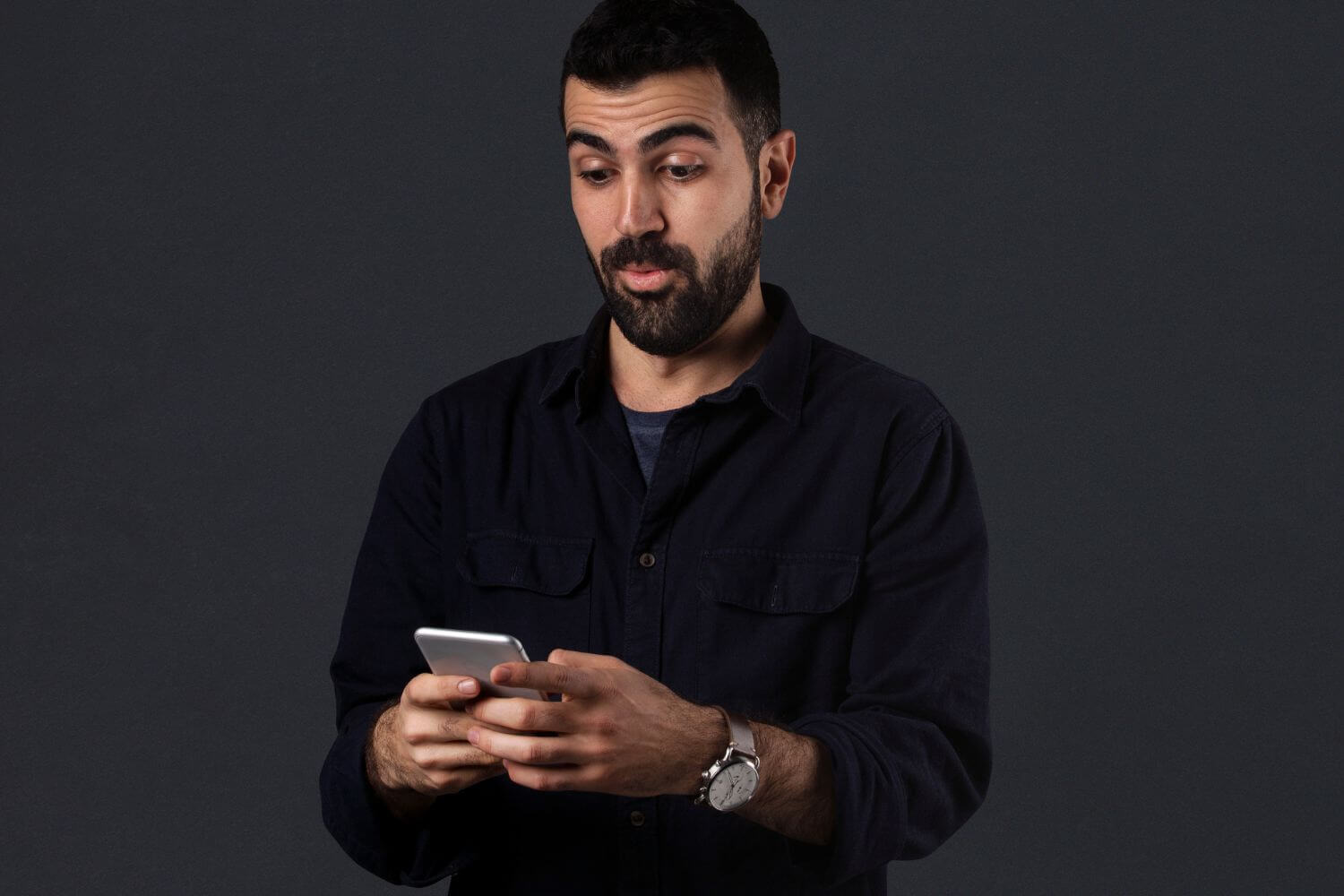 An image of a man using a phone.