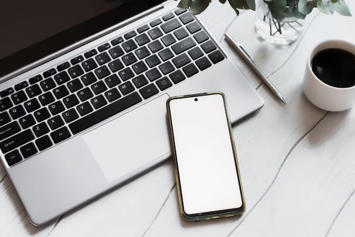 An image shows a laptop and a phone.