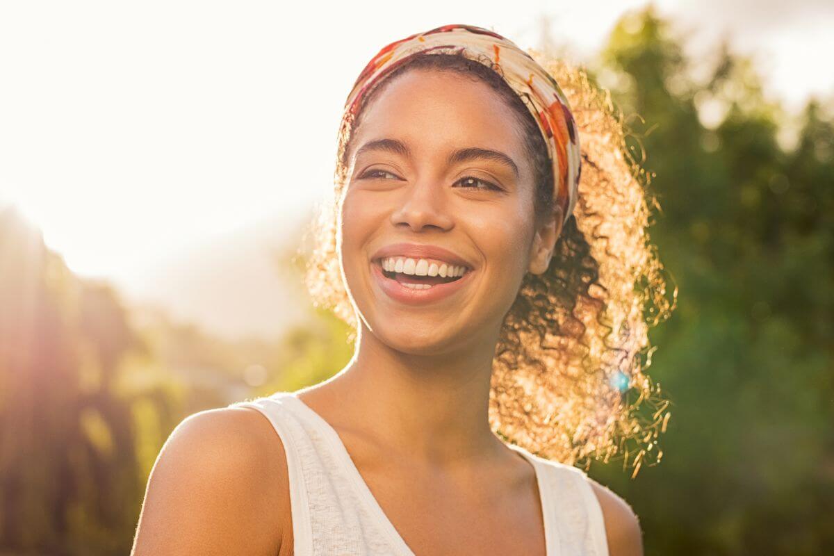 A photo of a smiling woman. 