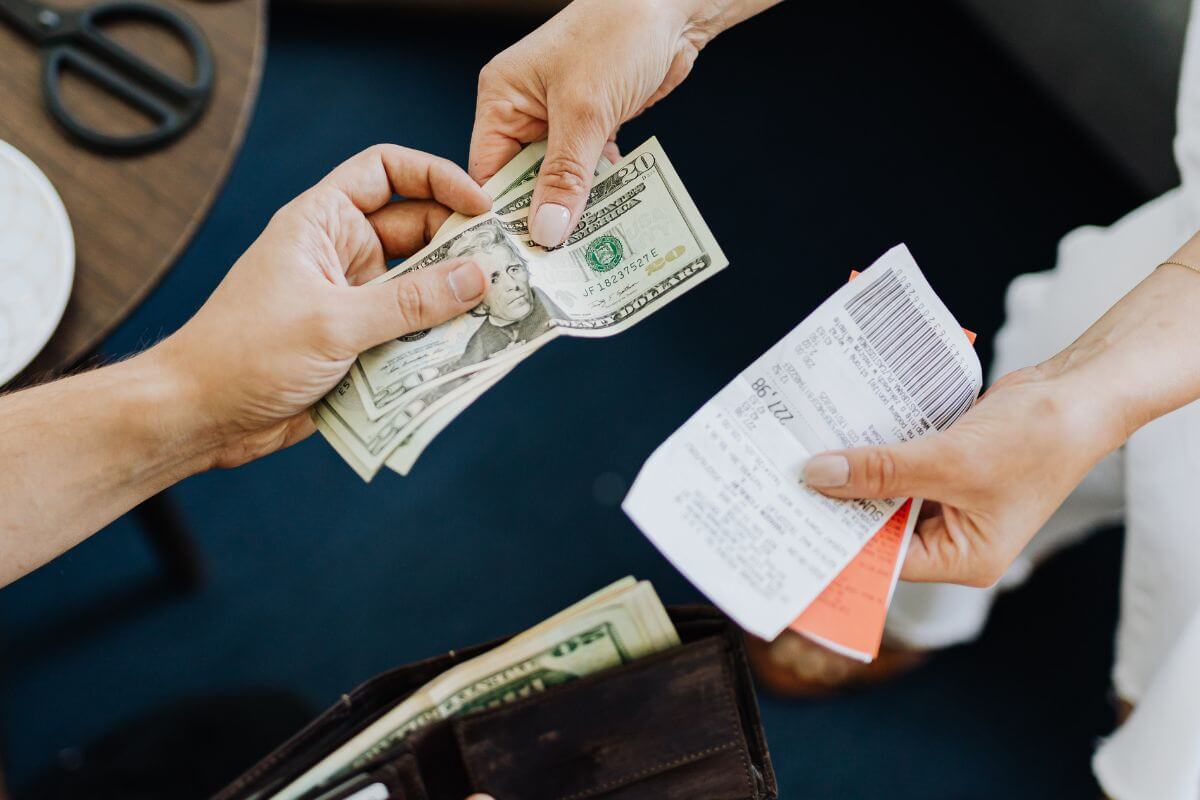 A picture of someone paying their debt.