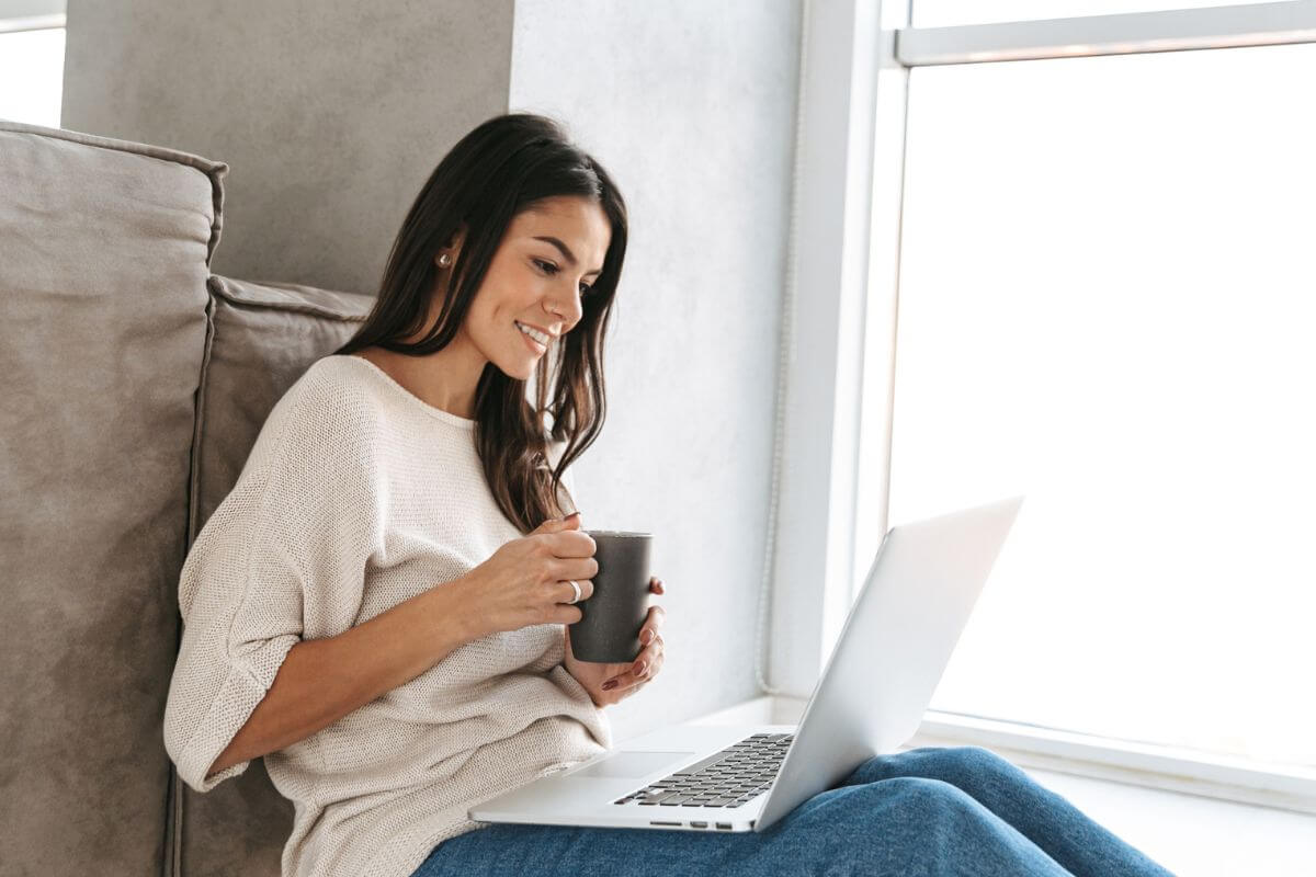 A picture of someone using their laptop.