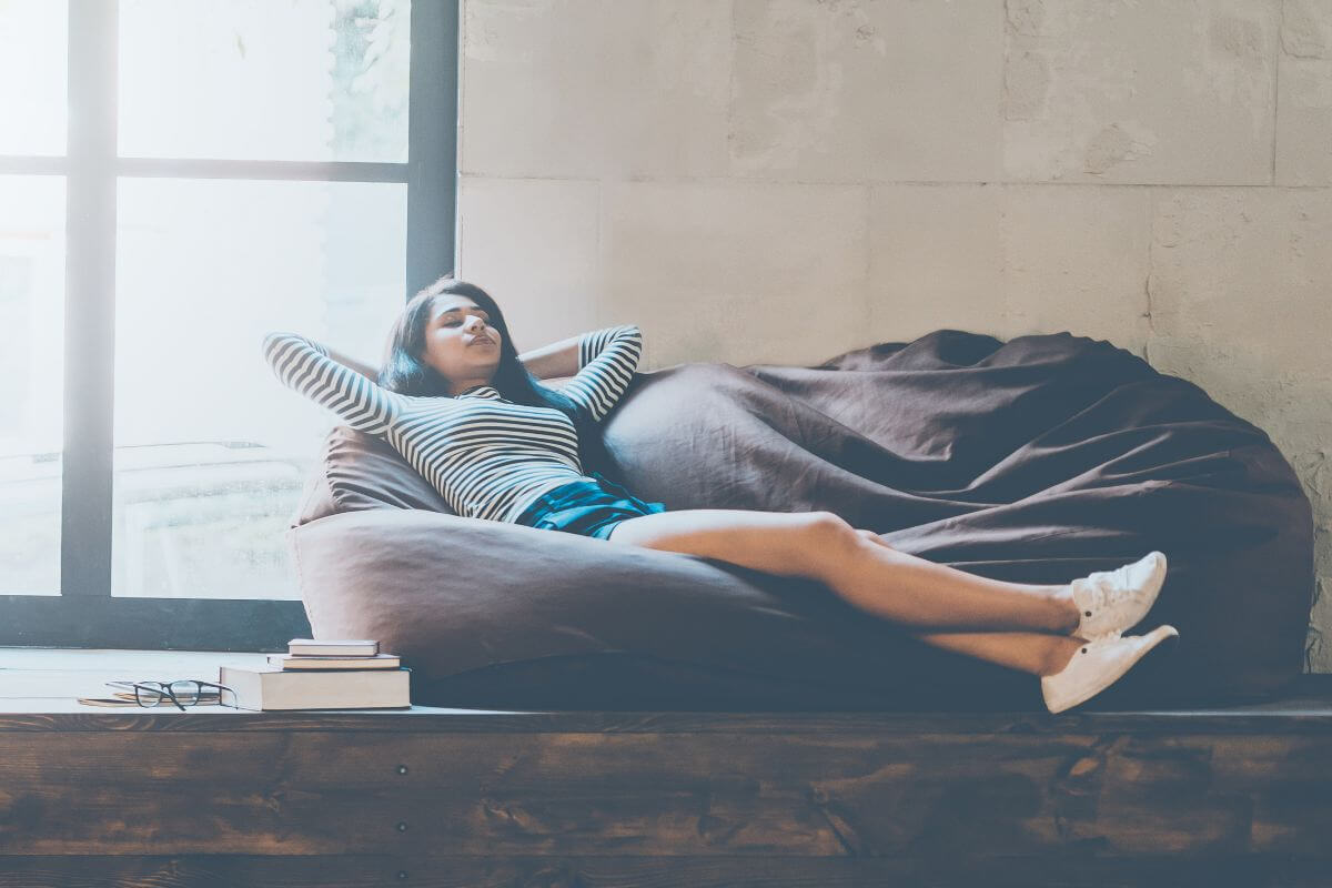A picture of someone chilling on a sofa.