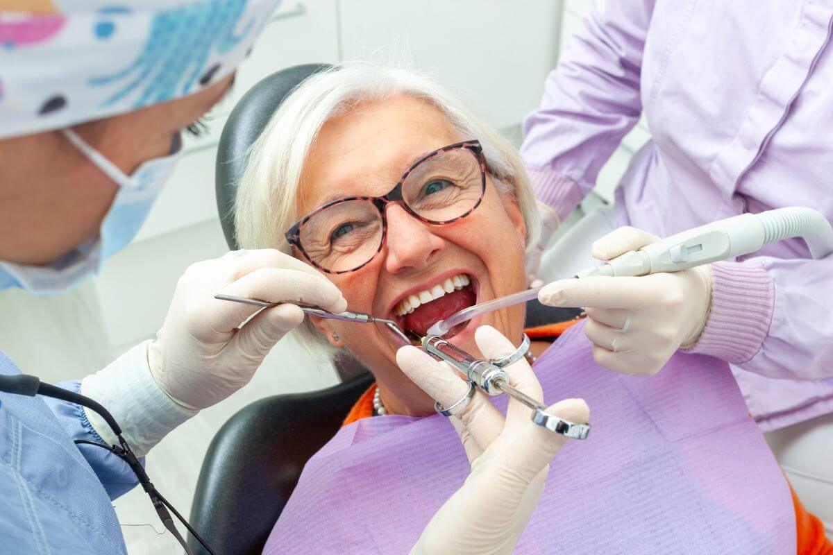 A picture of an elderly woman getting dental care.