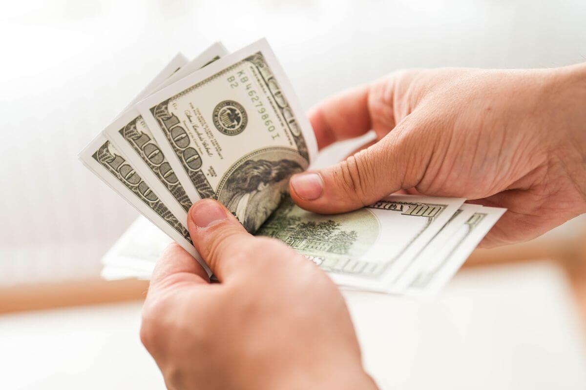 A picture of someone counting money.