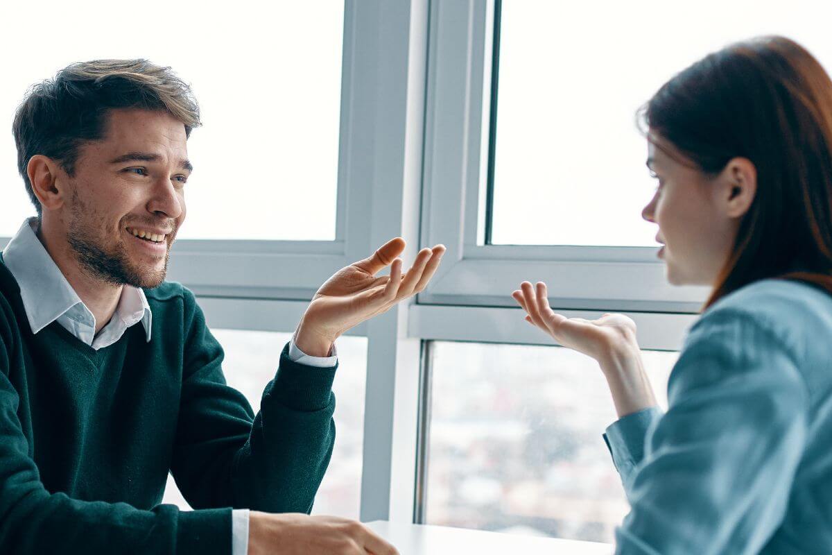 A photo of a couple happily talking. 