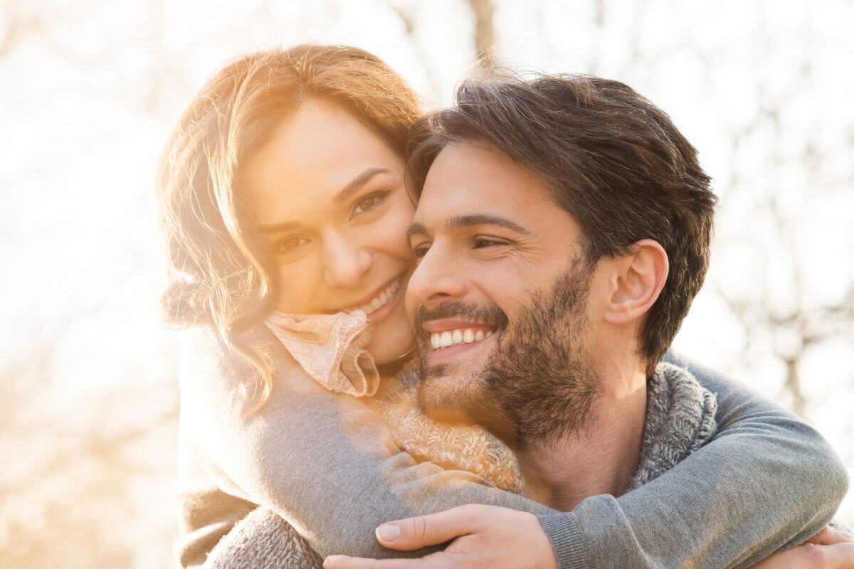 A photo of a laughing couple. 