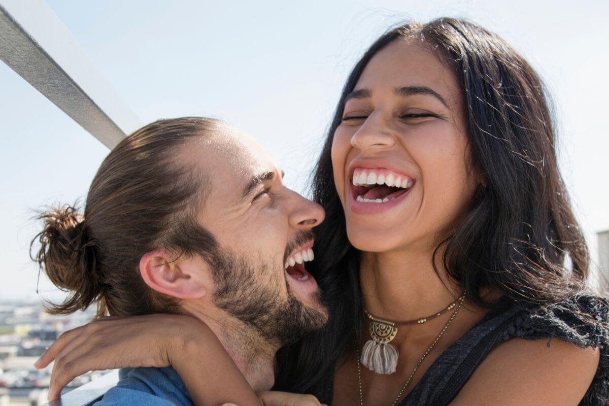 A photo of a smiling couple.