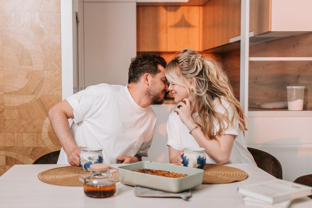 A photo of a couple eating together. 