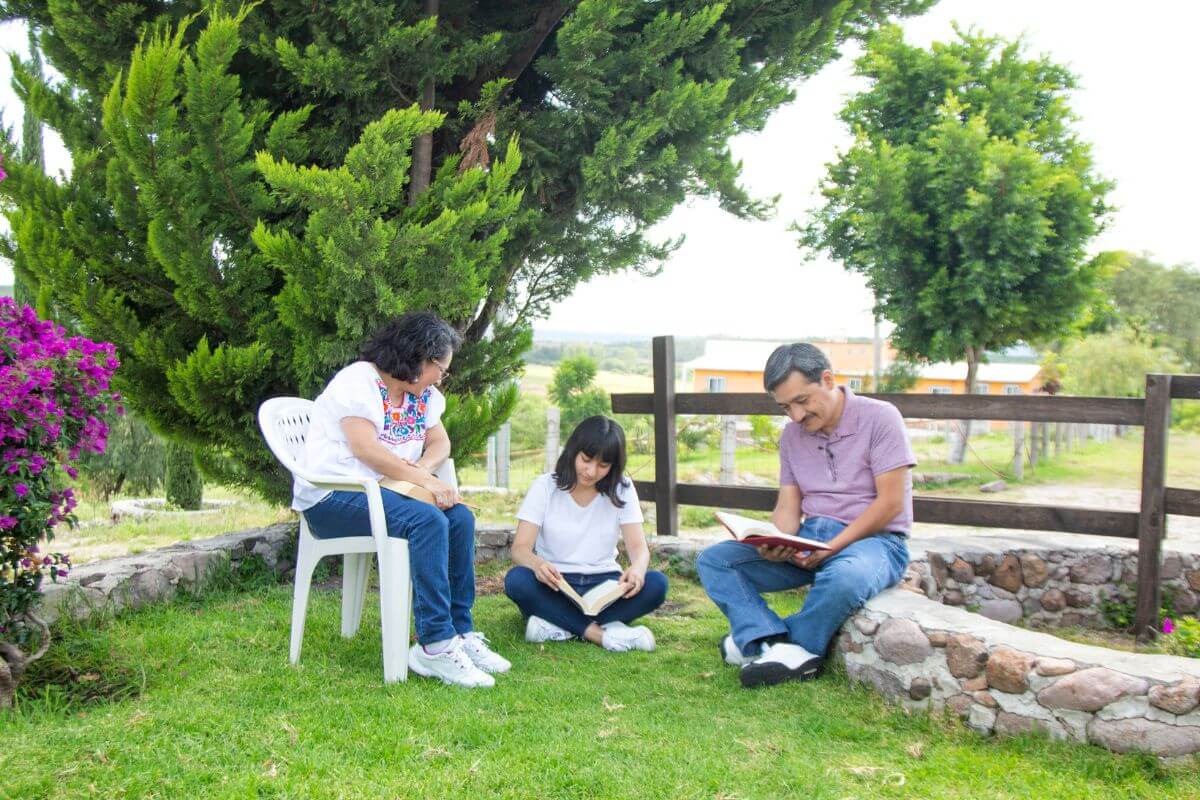A picture of a family in the backyard.