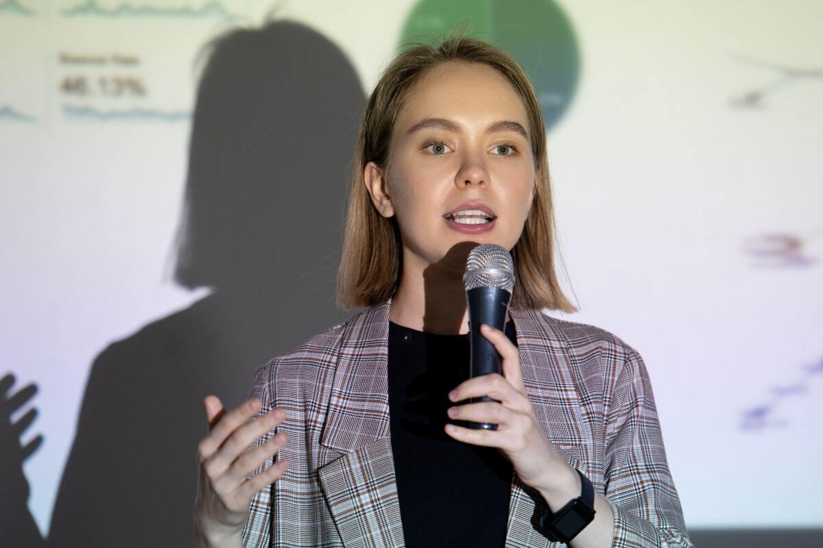 A picture shows a woman doing public speaking.
